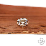 Bottom profile cushion brilliant cut loose moissanite on wood