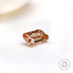 Side angle of fancy orange emerald cut diamond
