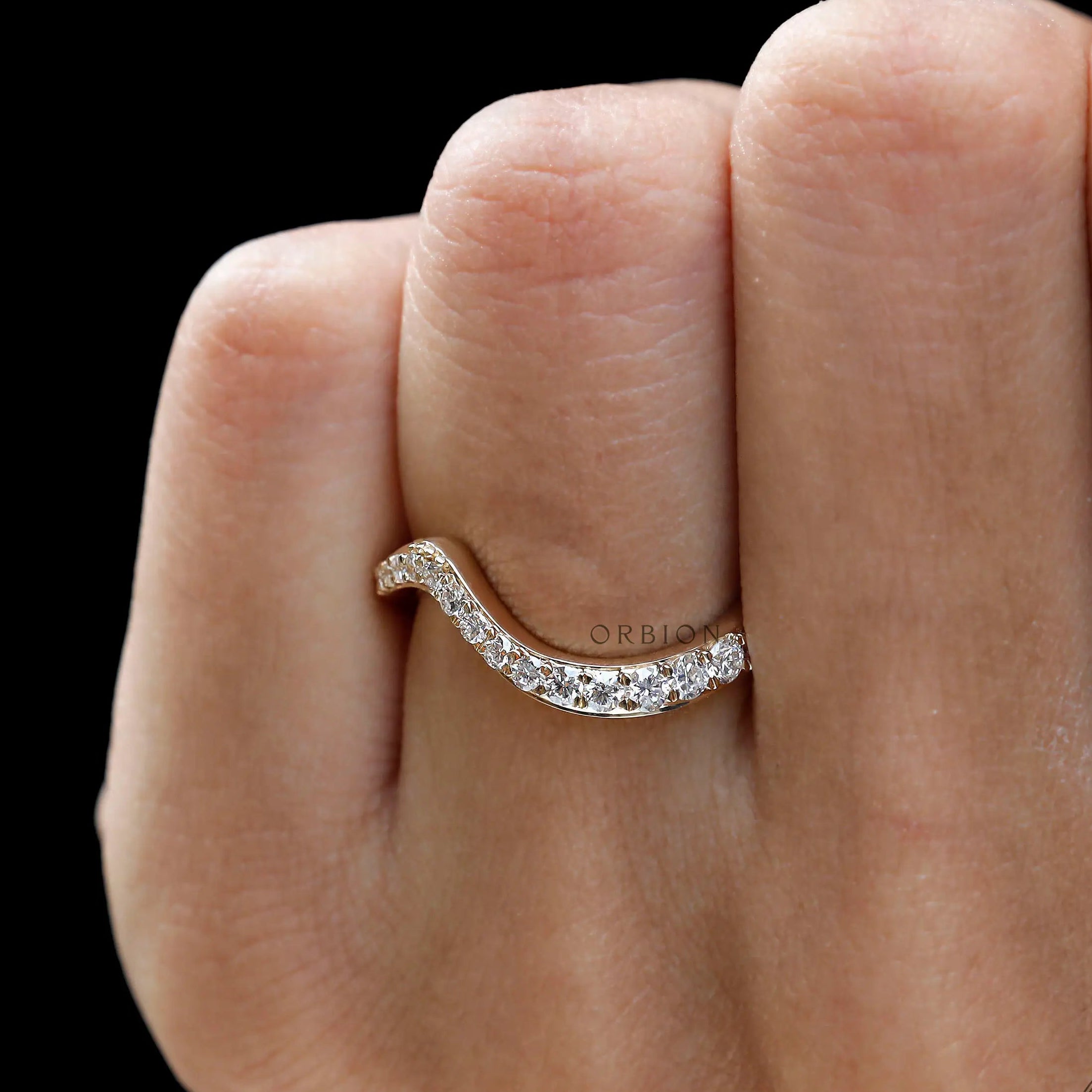 Diamond wedding band worn on hand with elegance