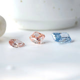 Mixed gemstone display featuring blue radiant lab diamond