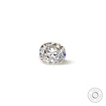 Loose elongated cushion old mine cut moissanite resting flat