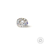 Loose elongated cushion old mine cut moissanite resting flat