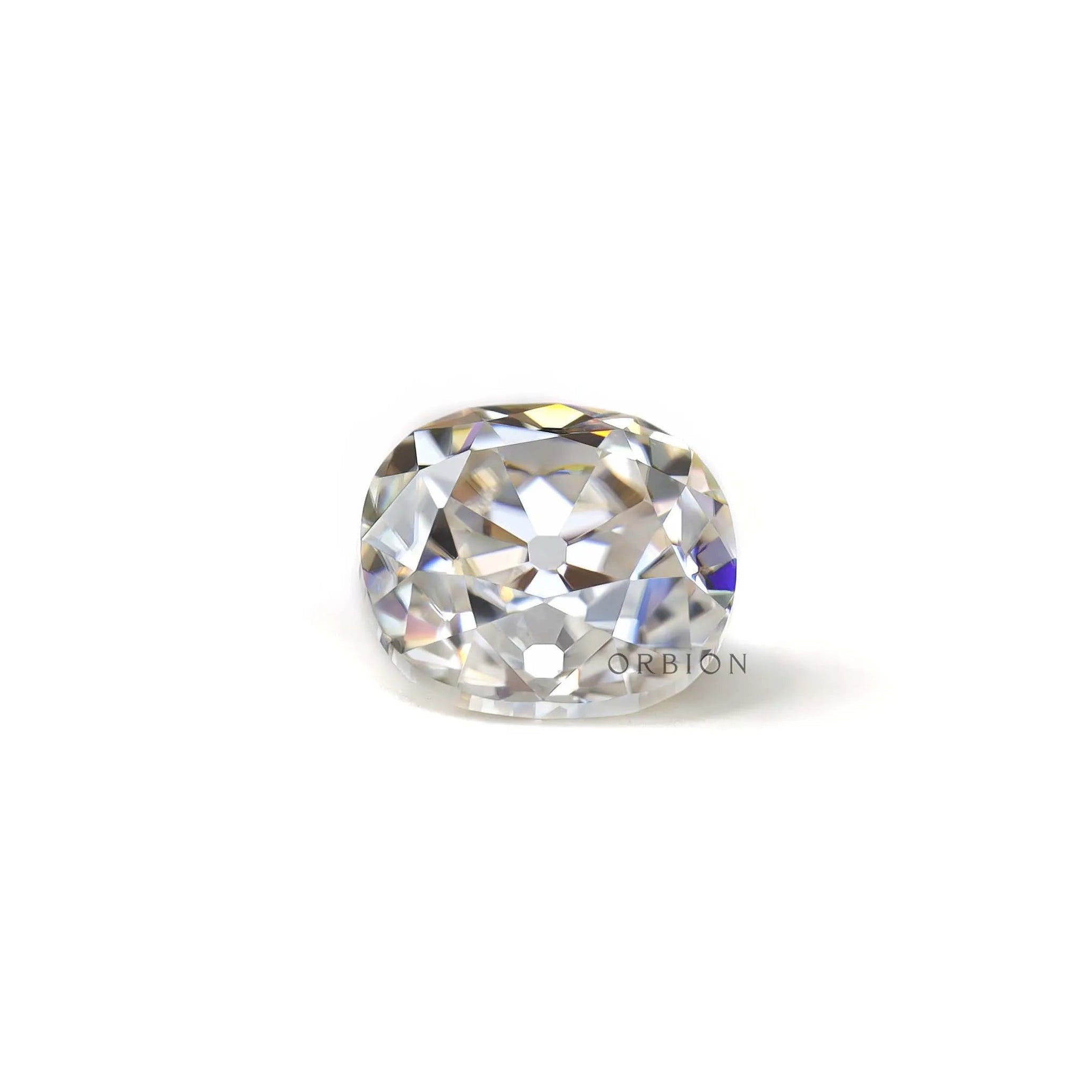 Loose elongated cushion old mine cut moissanite resting flat