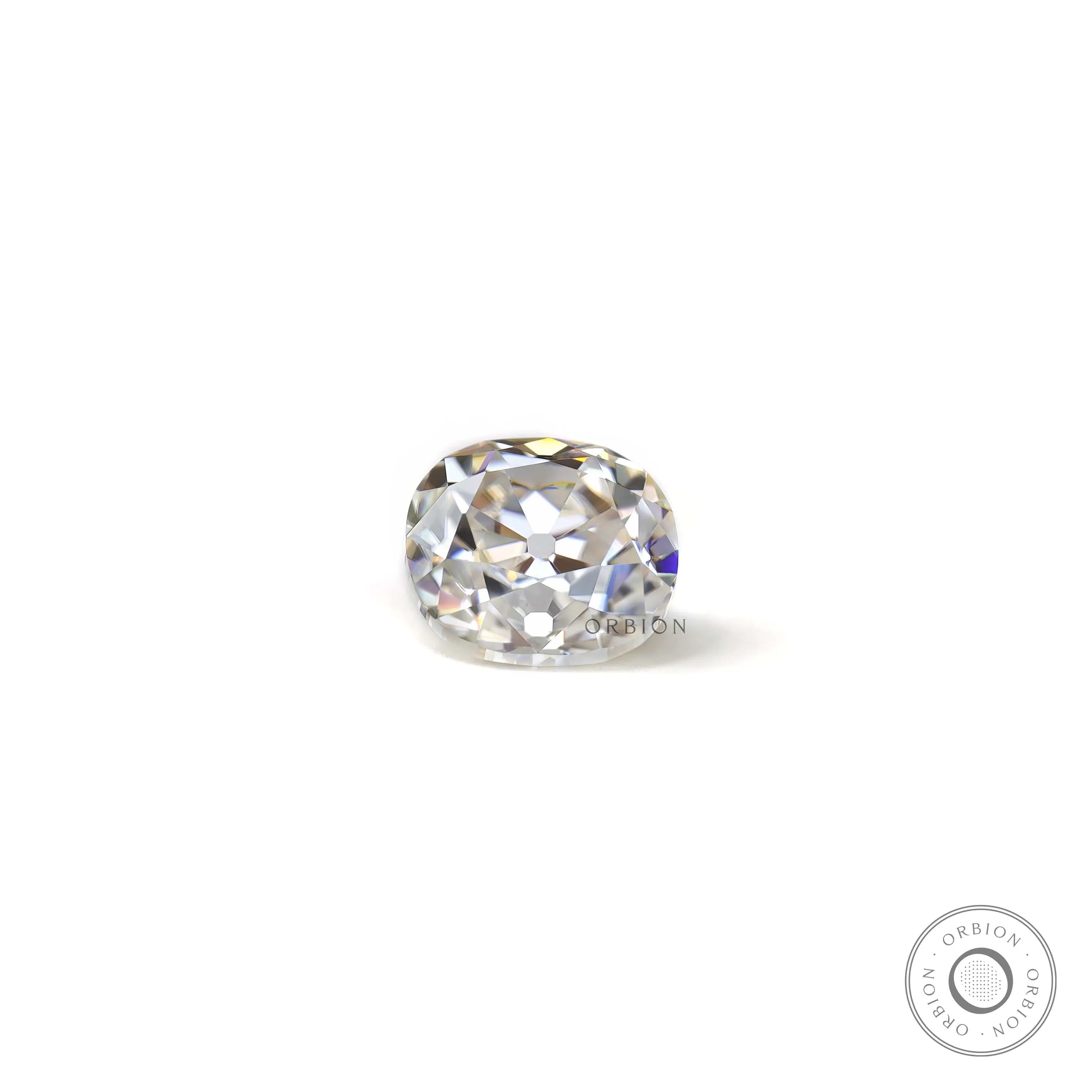 Loose elongated cushion old mine cut moissanite resting flat