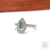 Elegant Light Green Moissanite Halo Ring in White Gold - Perfect for Proposals Unique and Sparkling Pear Cut Design, A Timeless Choice