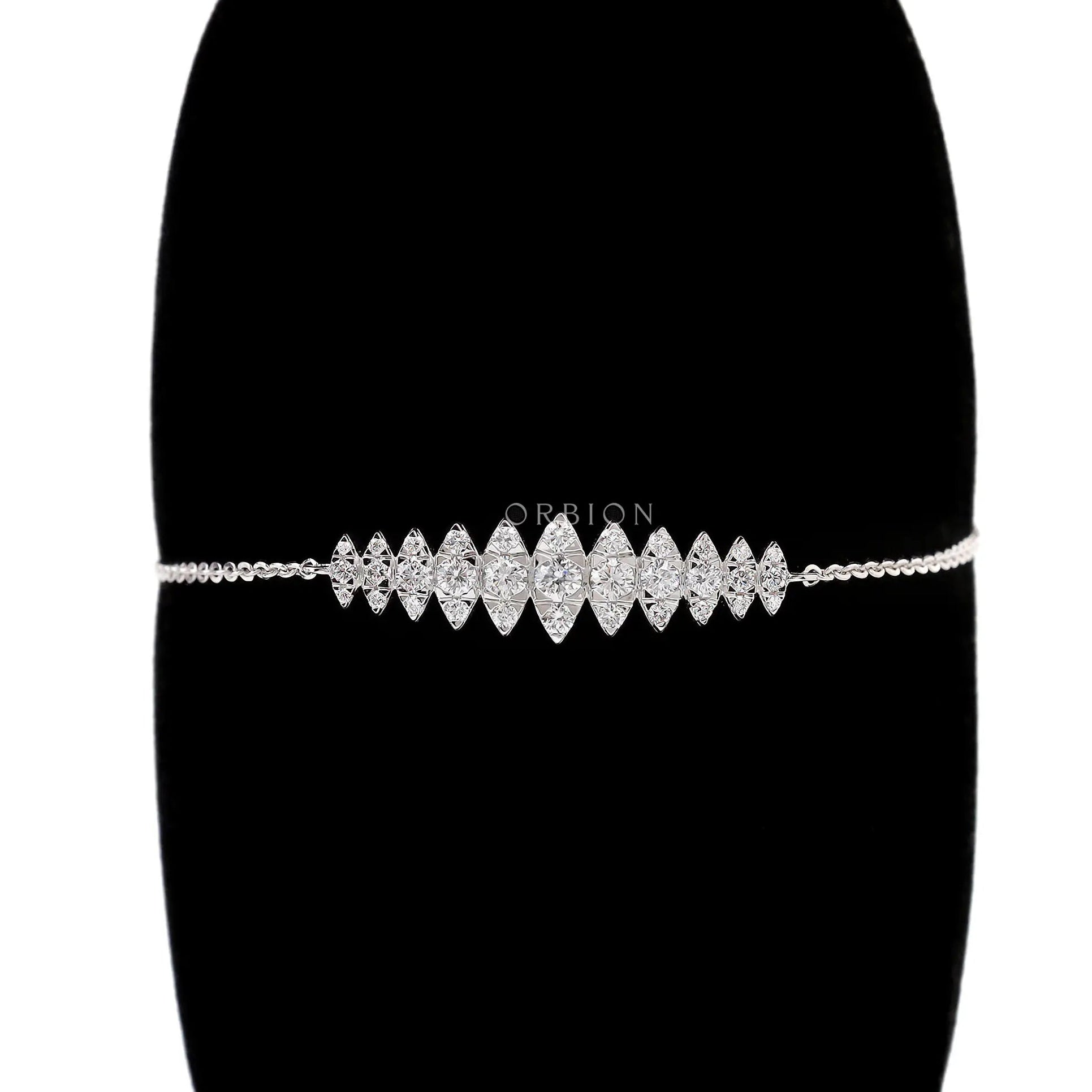 Marquise shaped lab grown diamond bolo bracelet front view on black stand