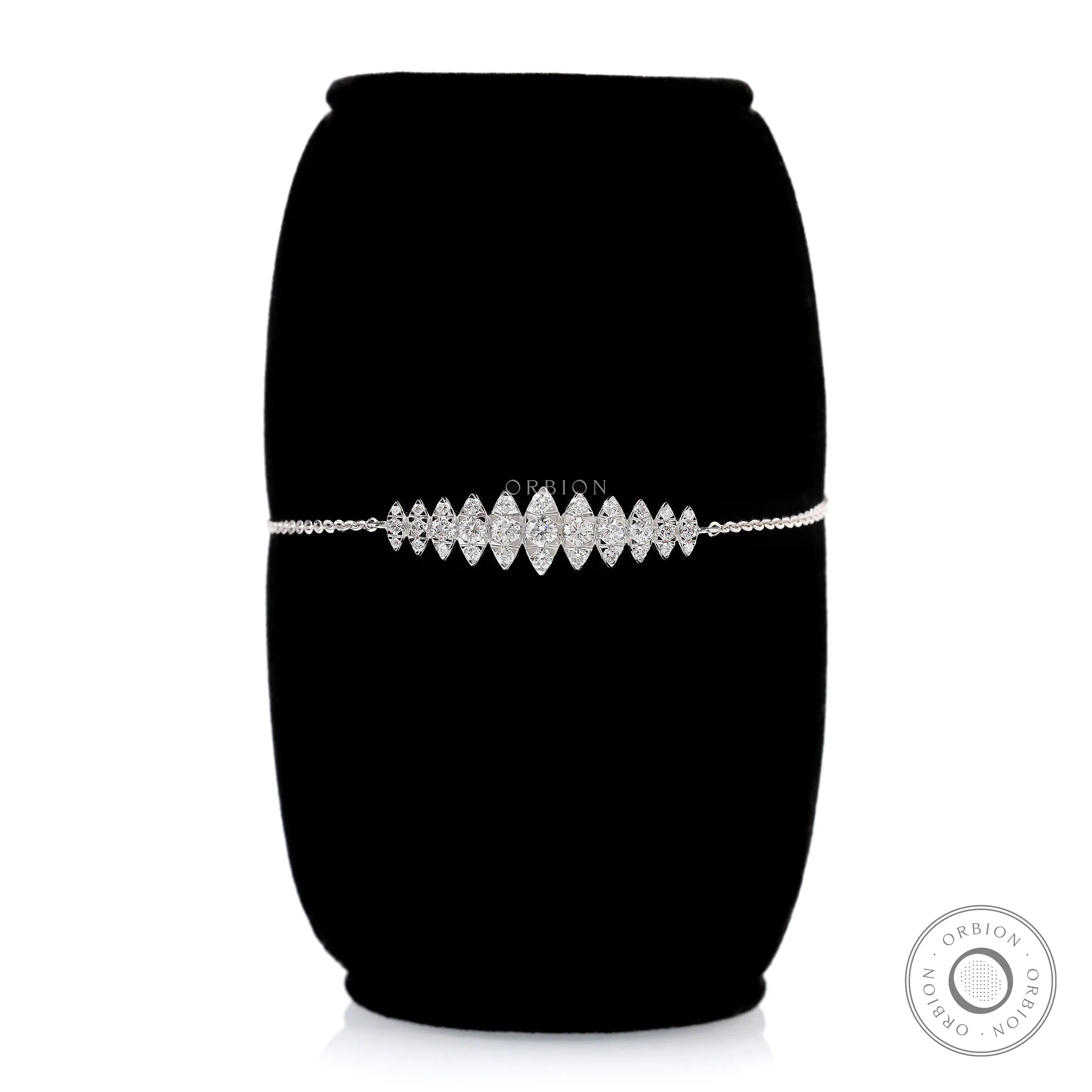 Marquise shaped lab grown diamond bolo bracelet front view on black stand