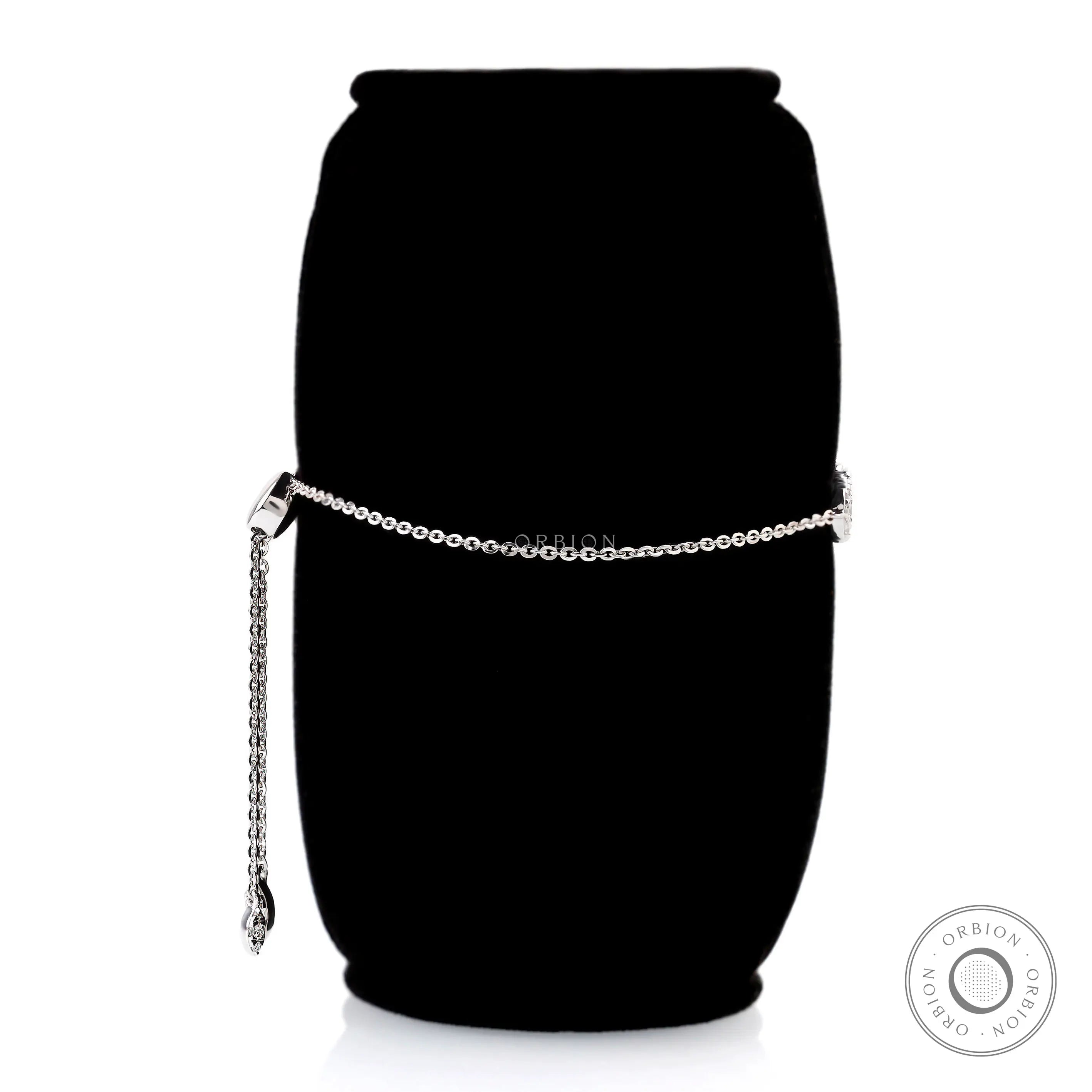 Side view of solid gold diamond bolo bracelet with adjustable chain