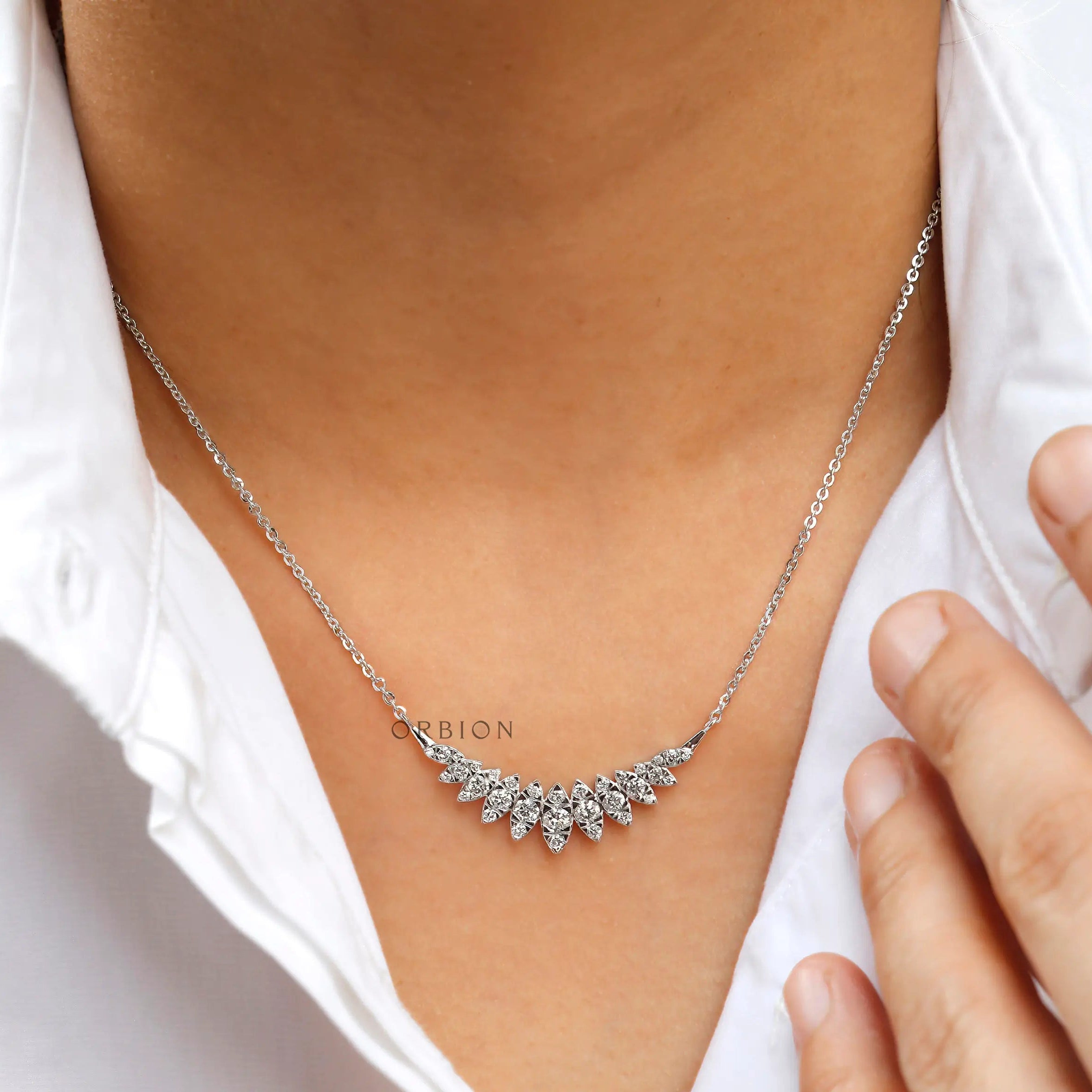 Glossy 14k white gold contemporary diamond necklace close-up