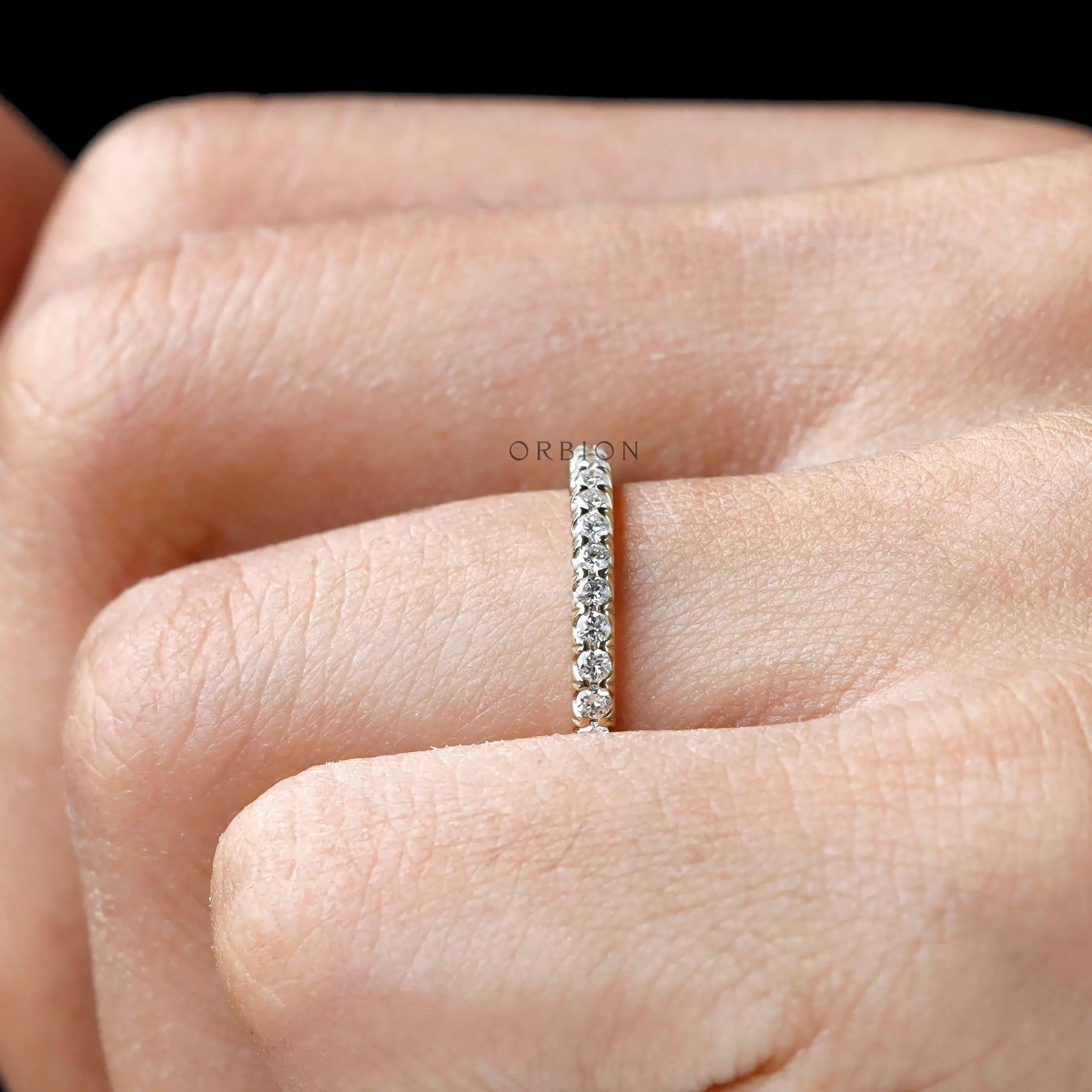 Thin yellow gold anniversary band with 0.26 TCW diamonds