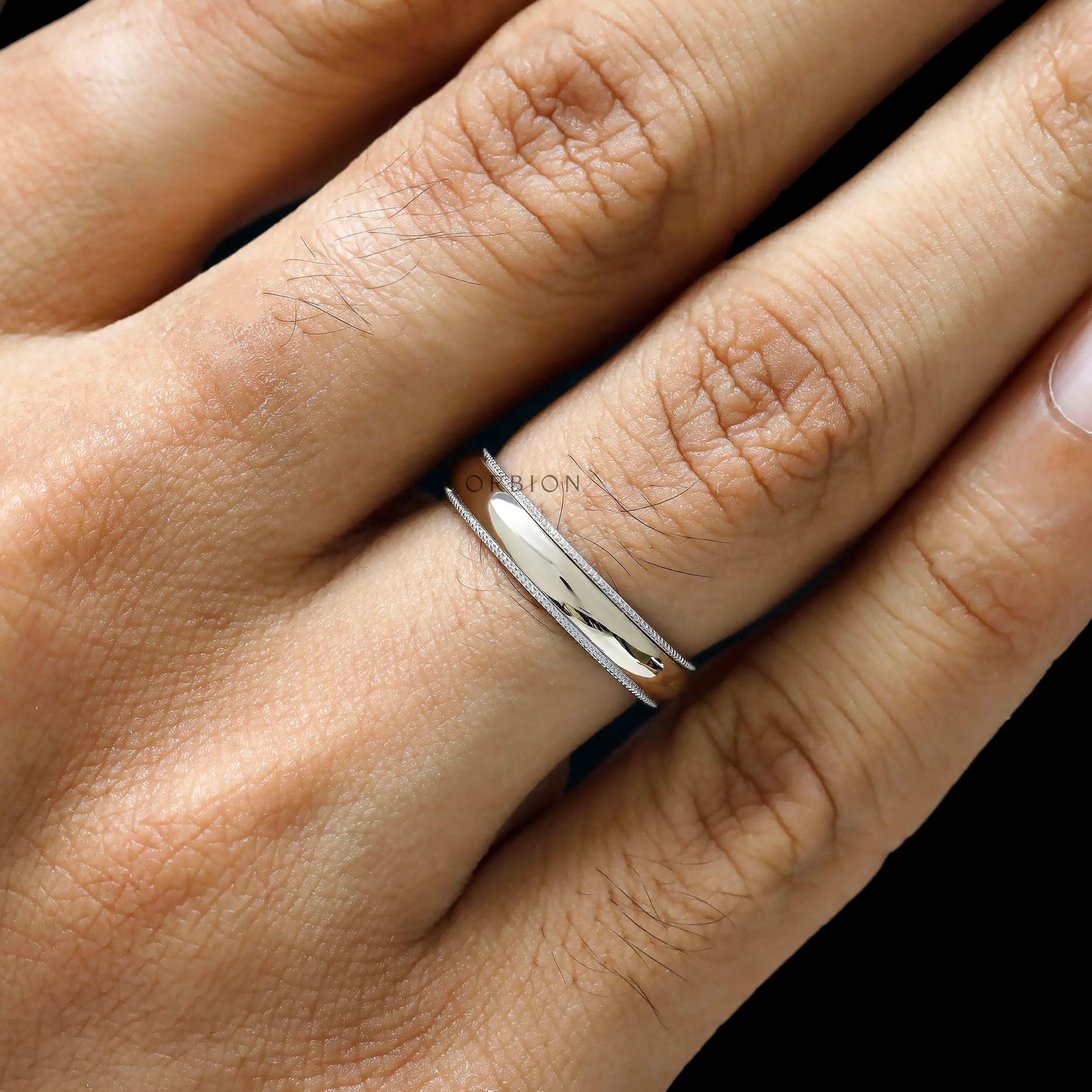 Polished mens two tone wedding ring with milgrain border