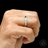 Hand wearing mens milgrain wedding band two tone gold