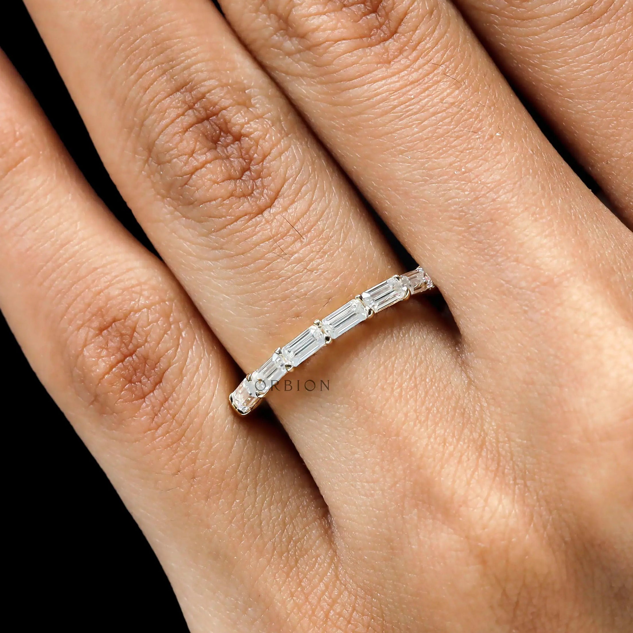 Emerald cut half eternity wedding band yellow gold