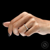 Emerald cut east west lab diamond band ring on wood surface
