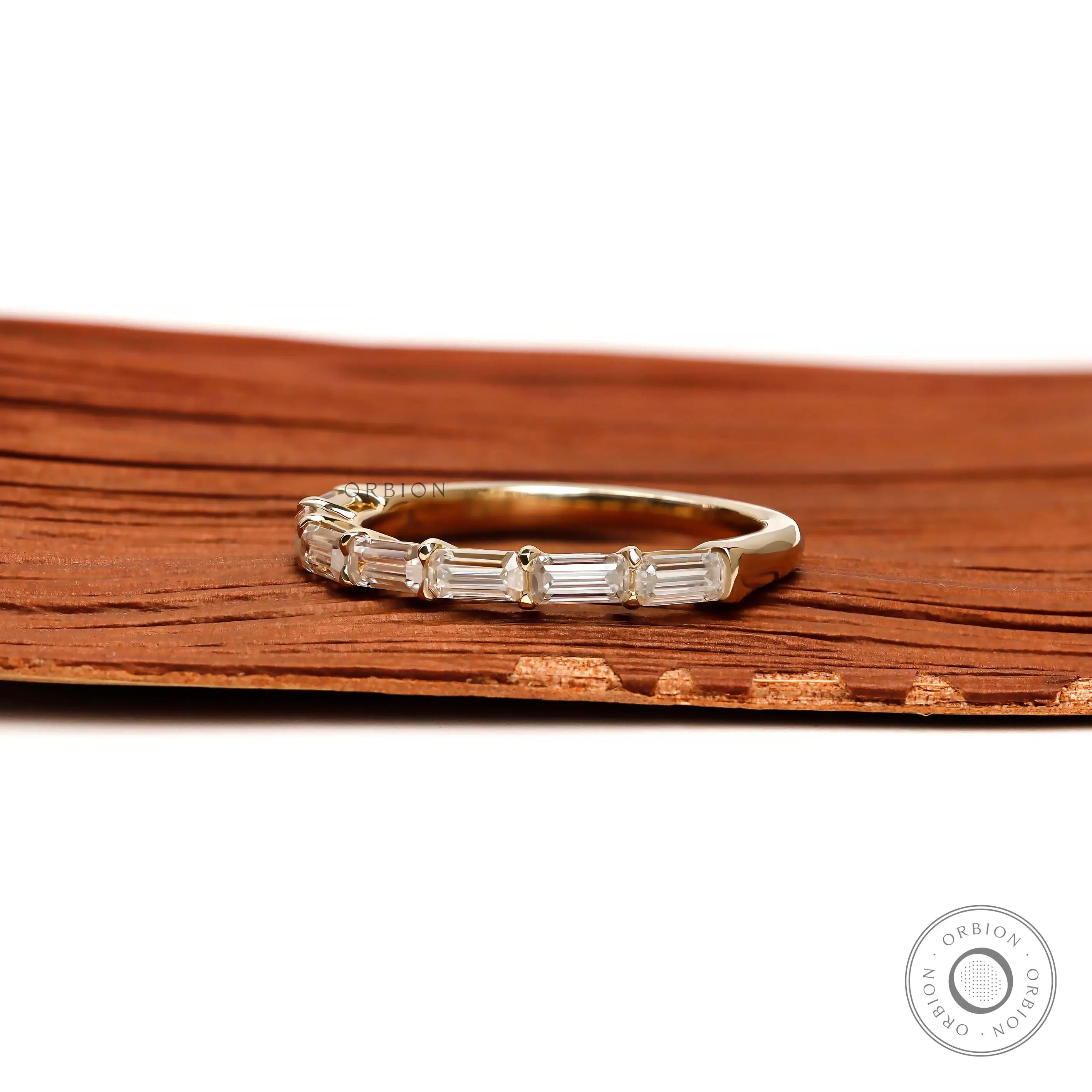 Elegant emerald cut moissanite band worn on finger