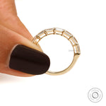 Emerald cut east west moissanite half eternity band in 10k yellow gold