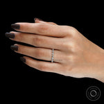 Side hand view of round lab diamond shared prong half eternity band