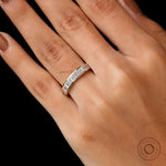 On hand view modern baguette moissanite wedding band