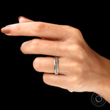 Close-up of baguette moissanite stones in channel worn on hand