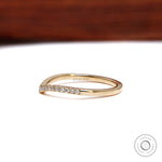 Opposite angled view of half eternity moissanite curved wedding band