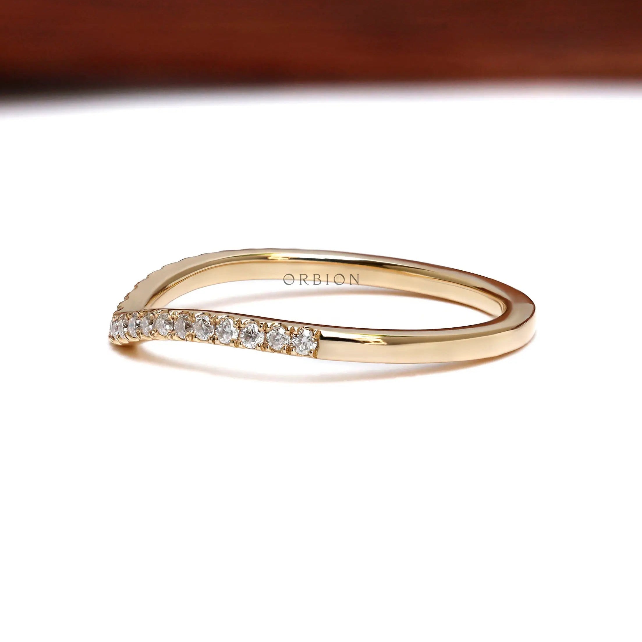 Opposite angled view of half eternity moissanite curved wedding band