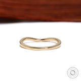 Back view of unique curved wedding band in yellow gold