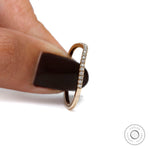 Side profile view of curved half eternity moissanite band