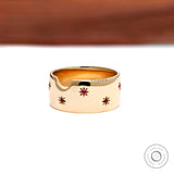 Synthetic ruby star set gold cigar band close up