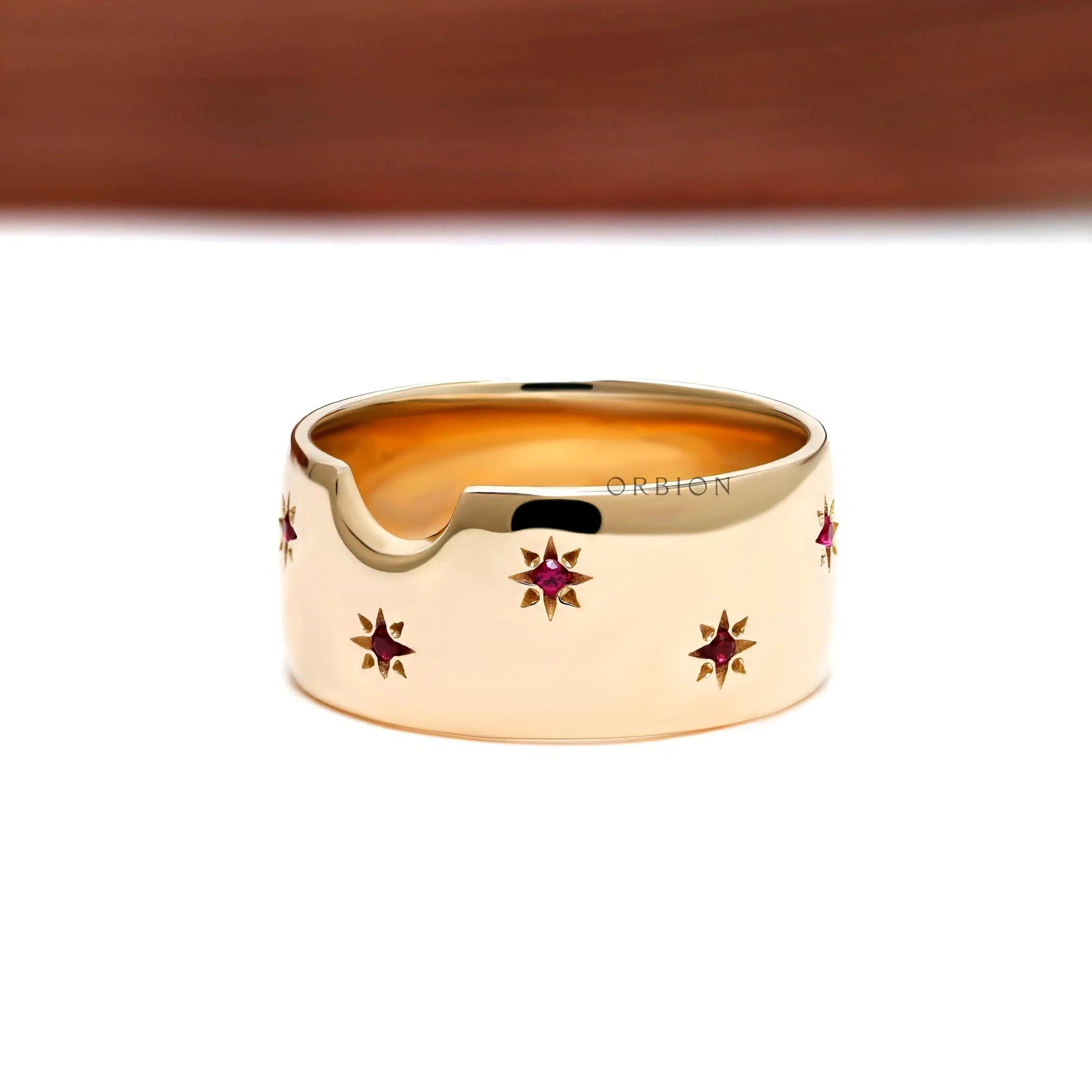 Synthetic ruby star set gold cigar band close up