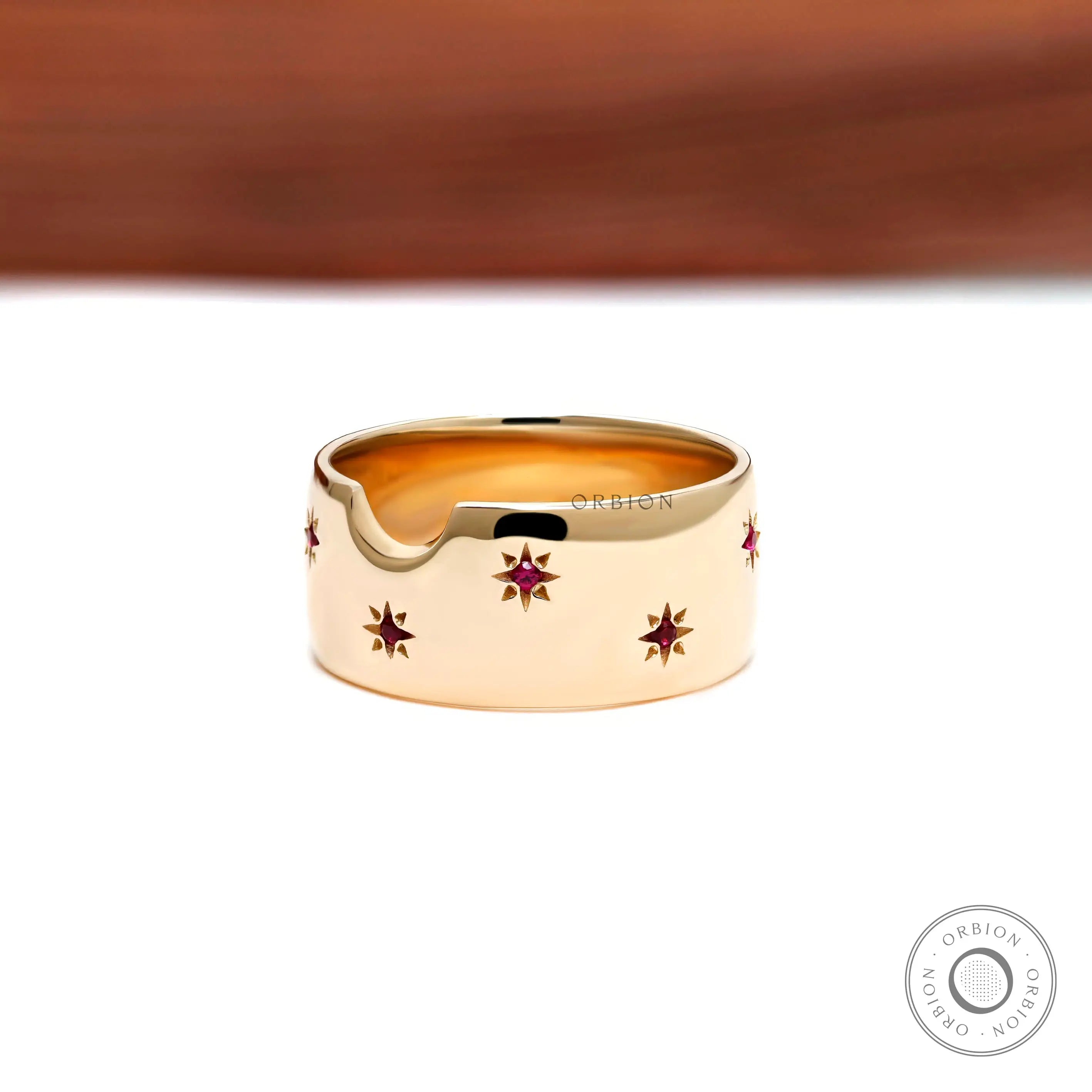 Synthetic ruby star set gold cigar band close up