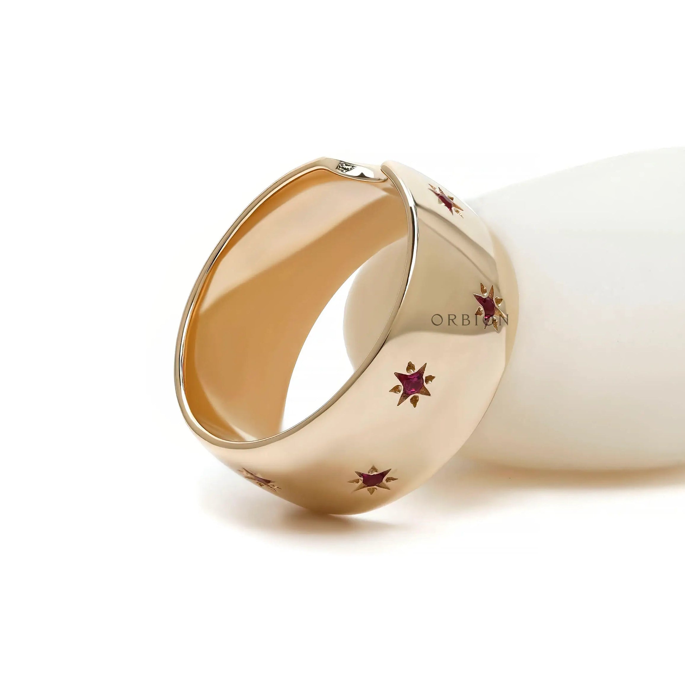 Glossy 10k gold stacking ring with starburst rubies