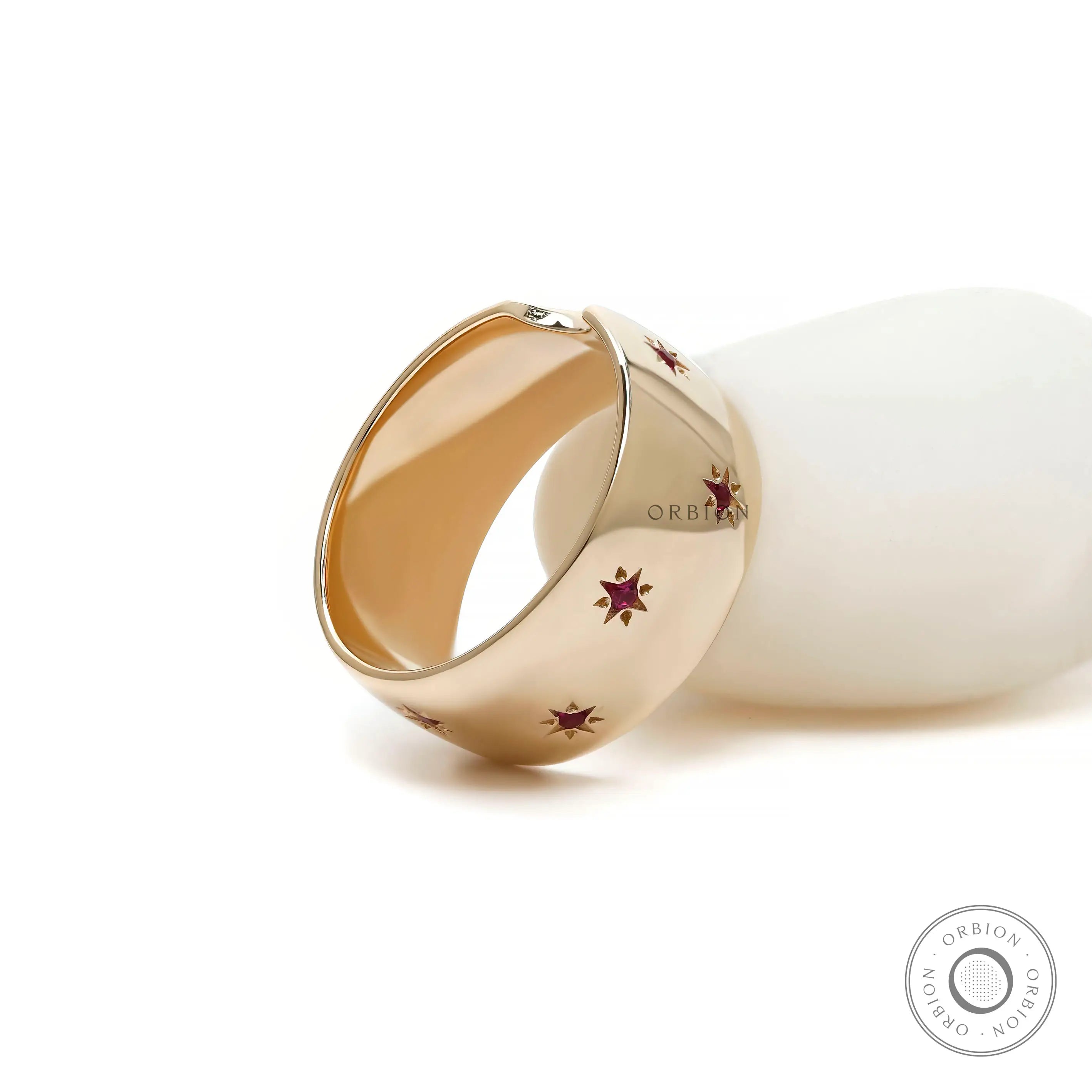 Glossy 10k gold stacking ring with starburst rubies