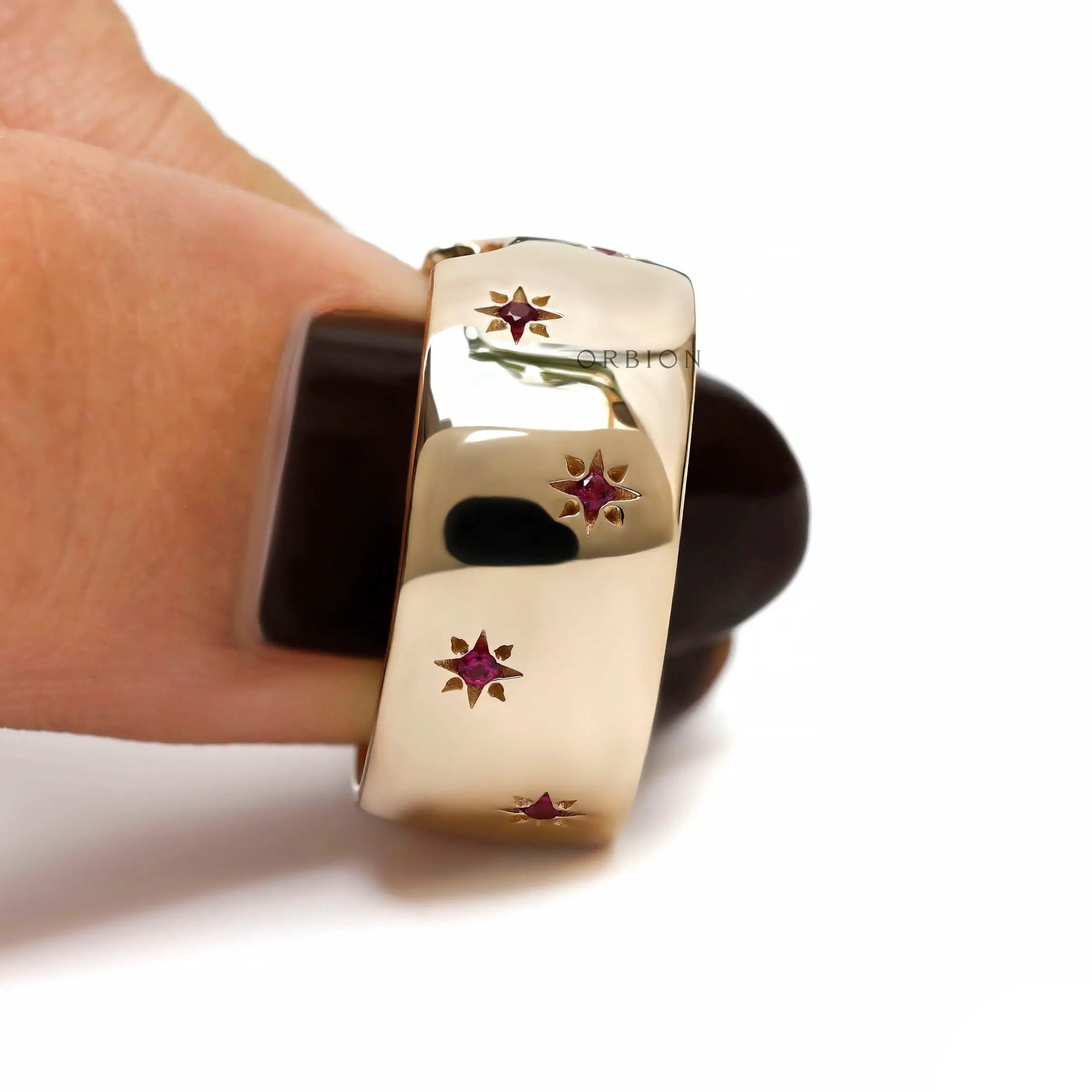 Women wide gold cigar band with red gemstones