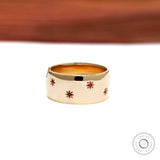 Bold yellow gold dome ring with red ruby stars engraved