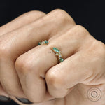 Minimalist wedding ring with leaf and vine motif, green lab gemstones and open yellow gold cuff