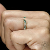 Nature-themed branch and leaf yellow gold ring with green lab gemstones, perfect for everyday wear
