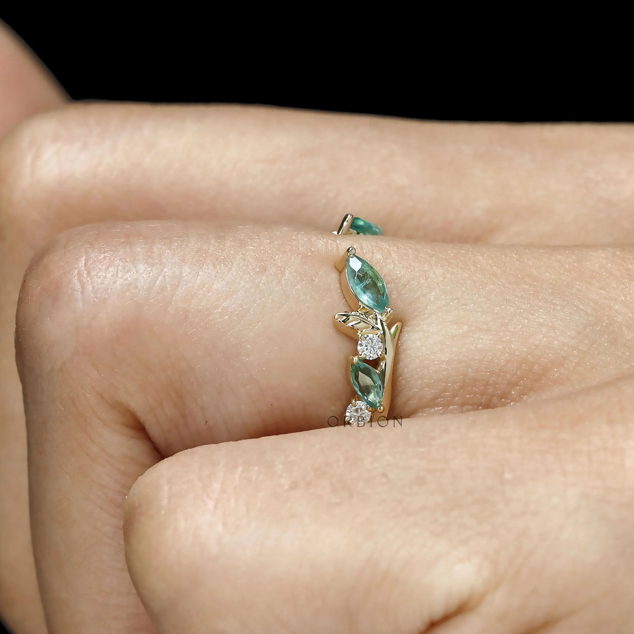 Nature-themed branch and leaf yellow gold ring with green lab gemstones, perfect for everyday wear