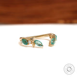 Delicate branch and vine wedding ring in yellow gold with green lab gemstones