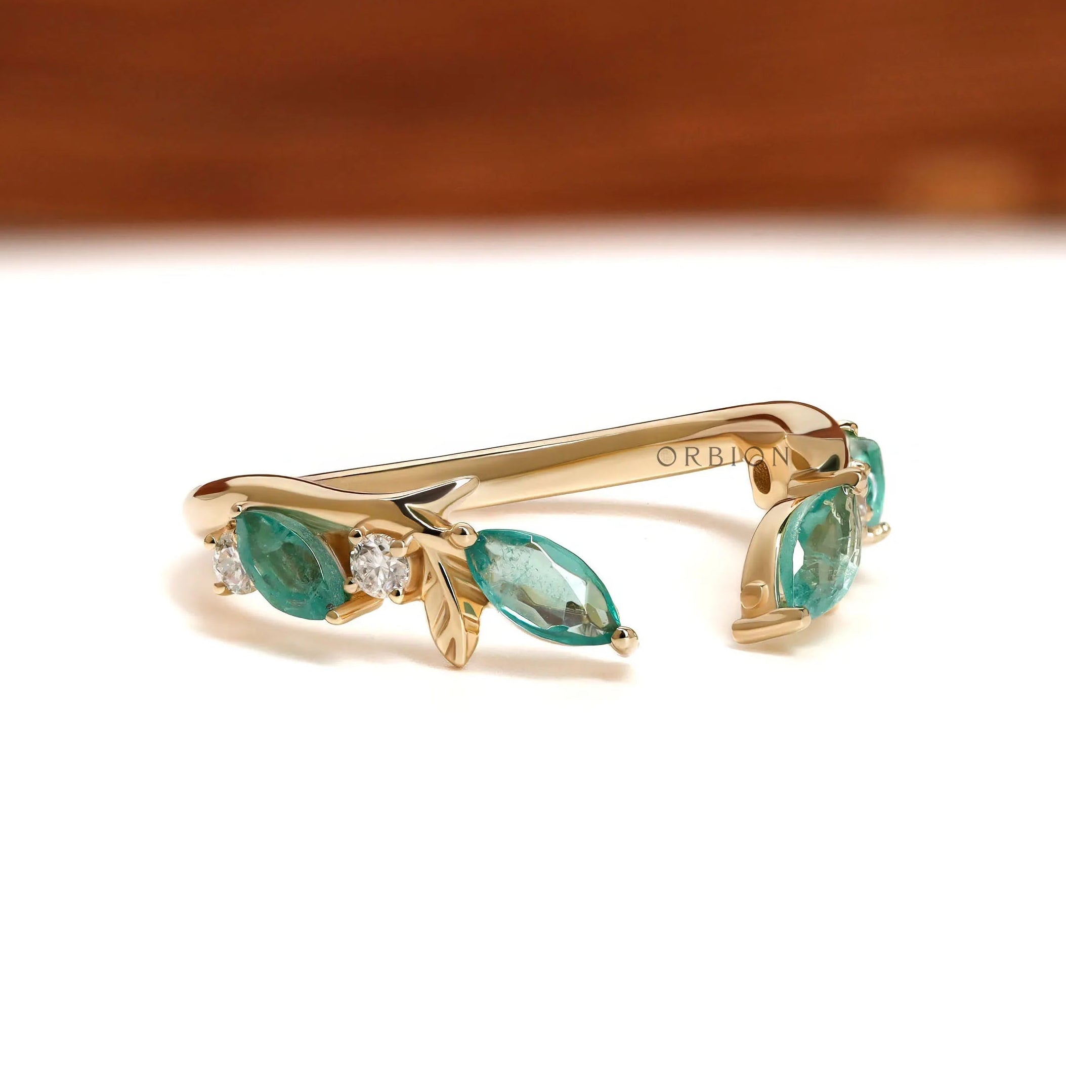 Delicate branch and vine wedding ring in yellow gold with green lab gemstones