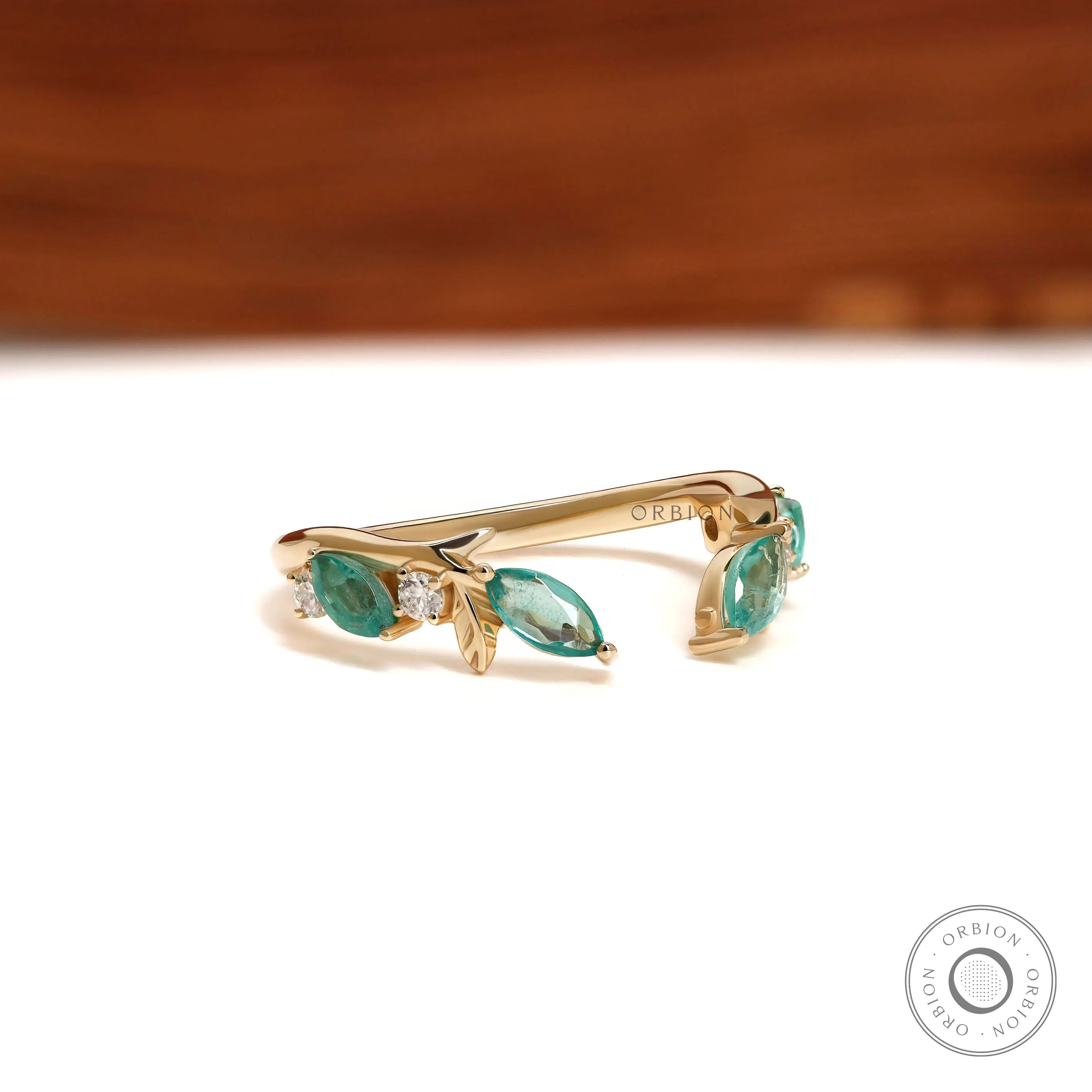 Delicate branch and vine wedding ring in yellow gold with green lab gemstones