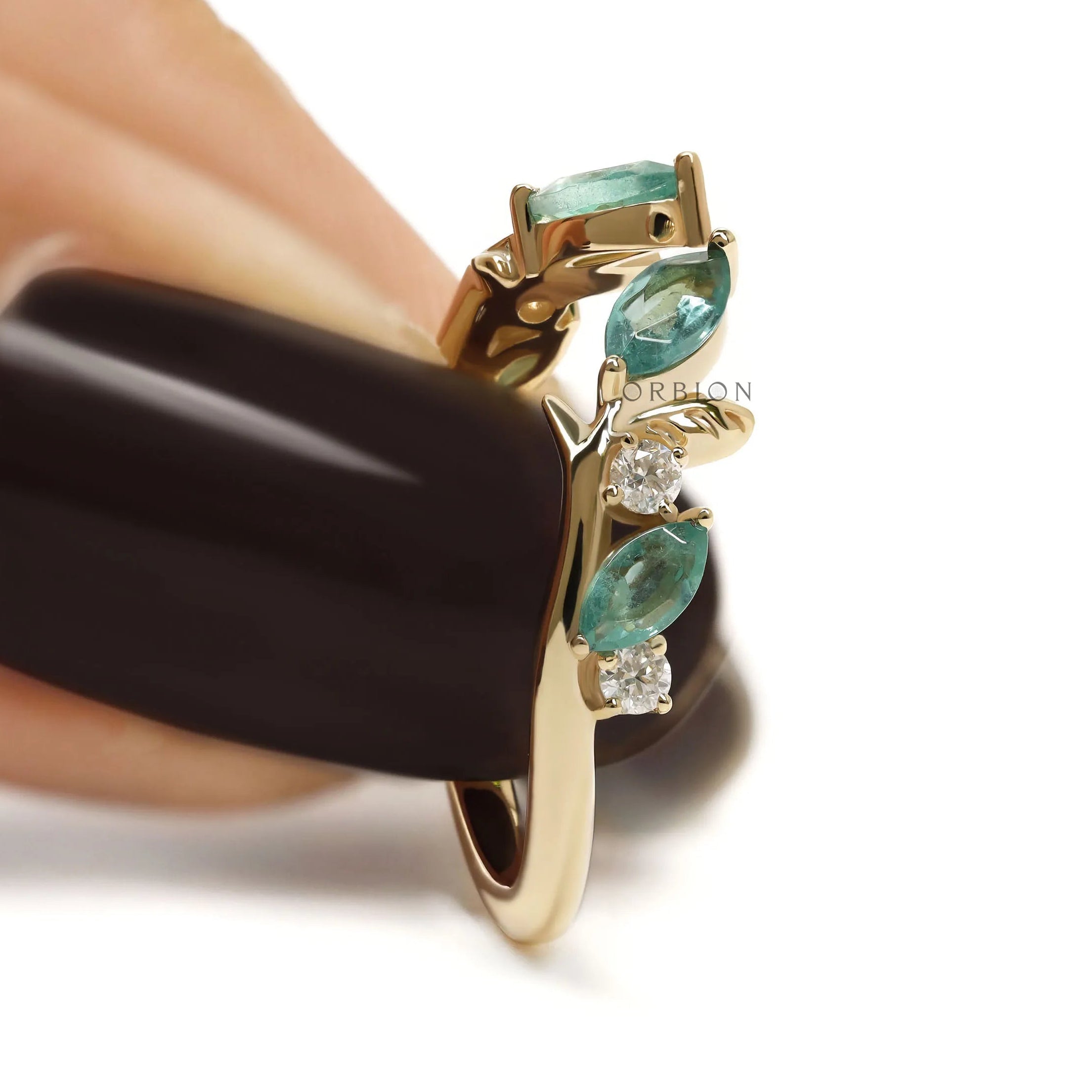 Elegant leaf-style yellow gold cuff ring accented with green lab gemstones, nature-inspired design