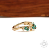 Minimalist leaf-inspired open cuff ring with green lab gemstones in 10k yellow gold for stacking