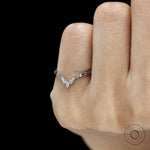 Minimal platinum stacking ring featuring black and white gemstones 