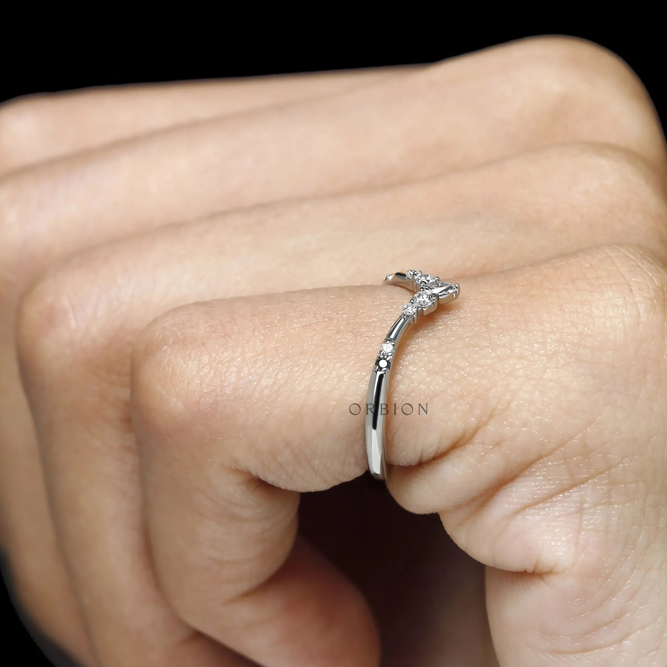 Platinum V shaped stacking band with gemstone accents, elegant chevron wedding ring for women