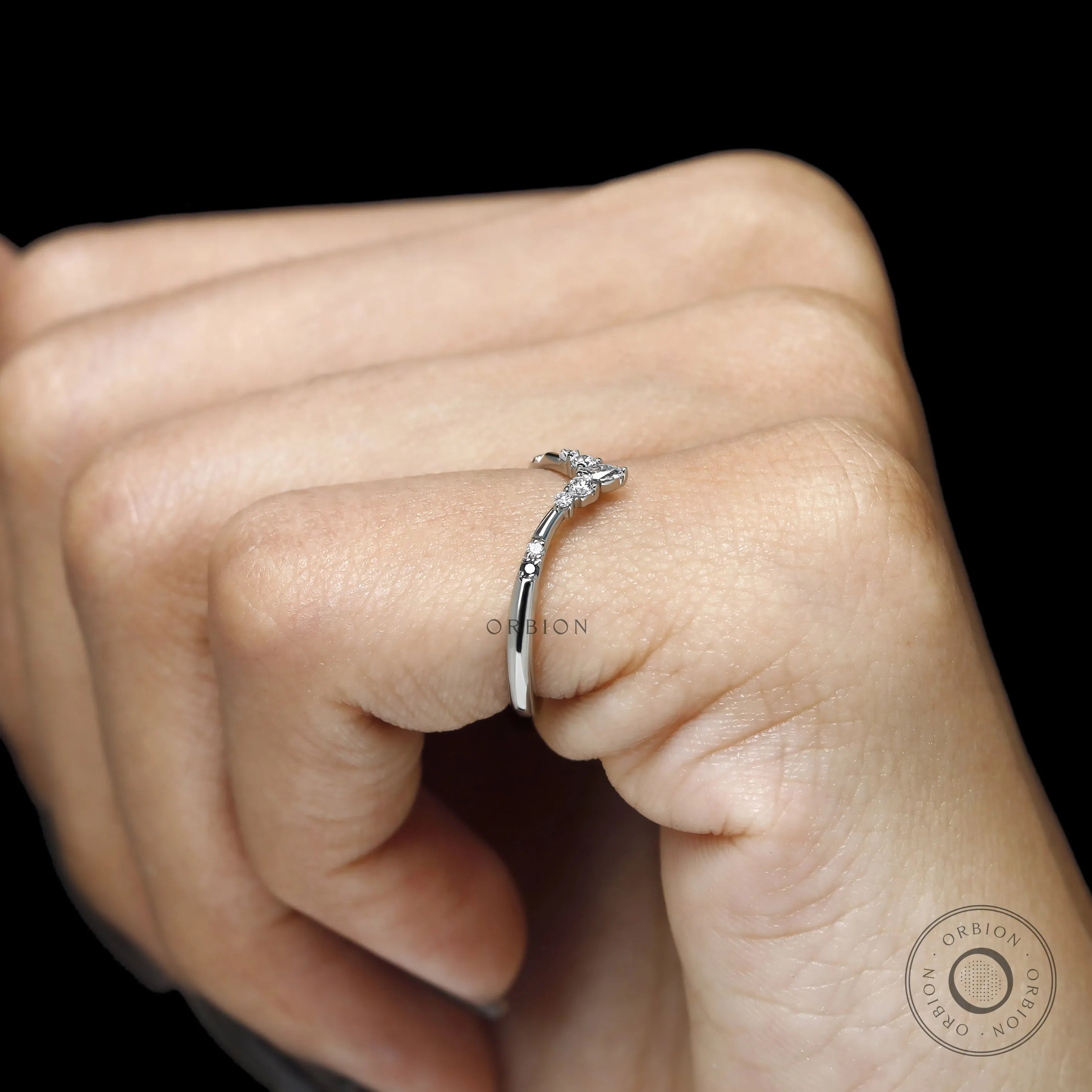Platinum V shaped stacking band with gemstone accents, elegant chevron wedding ring for women