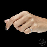 Curved wishbone wedding ring in platinum with black and white gemstones, minimalist fine jewelry design