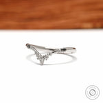 V shaped wishbone wedding band in platinum with black and white gemstone detailing for stacking