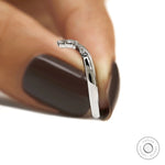 Dainty V shaped platinum stacking ring with contrasting gemstones for engagement ring pairing