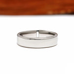 Modern platinum thumb ring for men featuring baguette diamonds and a flat comfort fit band design