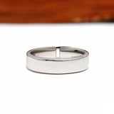 Modern platinum thumb ring for men featuring baguette diamonds and a flat comfort fit band design